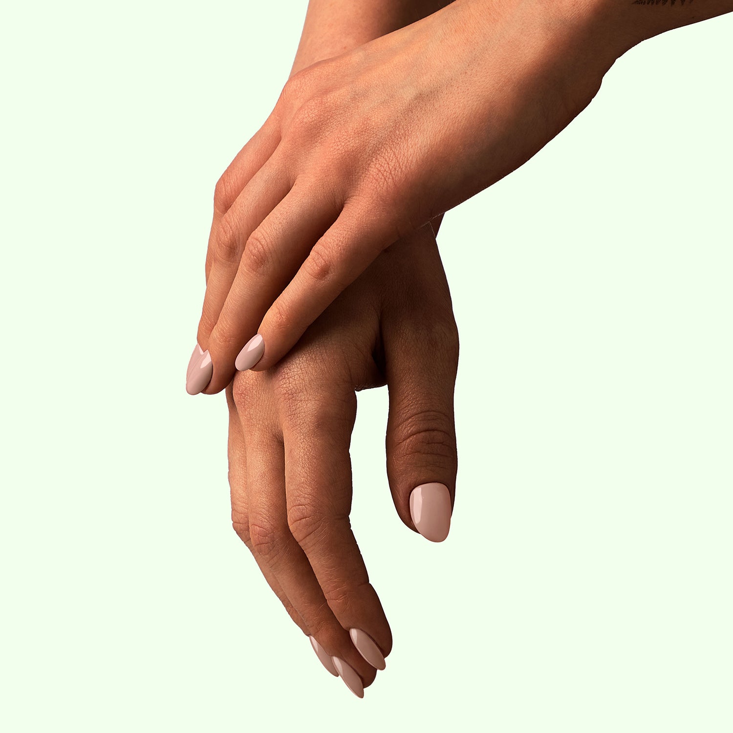 Glossy Blossom gel nail polish texture showing brush application. A warm nude colour. Available in 15ml and 8ml.